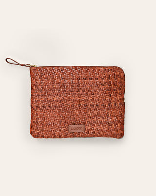 Cala Jade medium sized brown nutmeg leather pouch on a beige background
