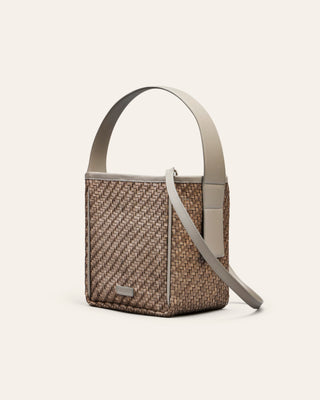 Cala Jade Iwa Mini woven patterned handbag with a strap on a light beige background