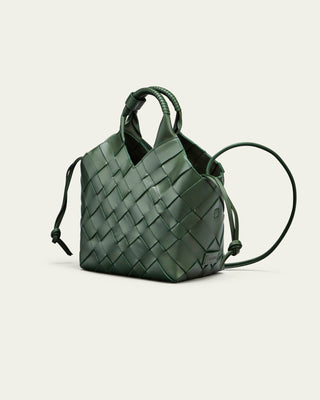 Cala Jade Misu - Green woven handbag on a light beige background