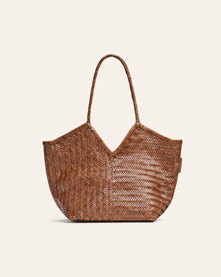 Woven brown handbag on a beige background