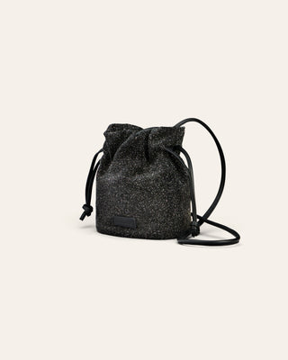 Cala Jade Jael black beam drawstring bag on a light gray background