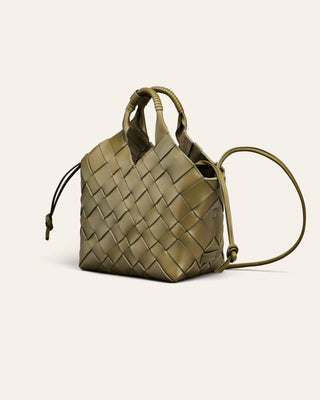 An olive green leather shoulder bag in a woven shape on a beige background