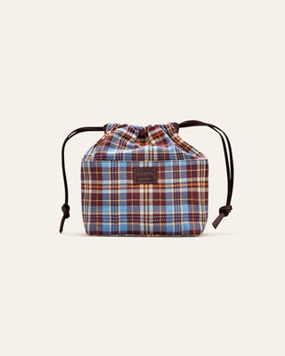Plaid drawstring bag on a light beige background