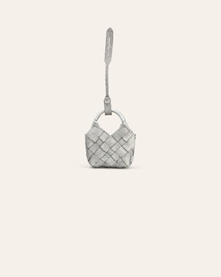 silver woven handbag charm on a light gray background