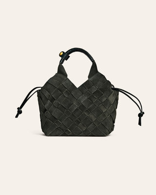 Dark green suede woven handbag on a light beige background