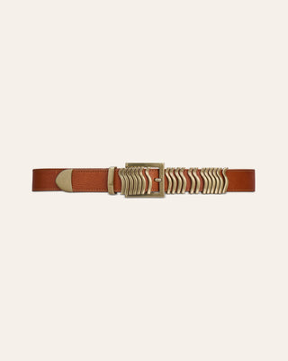 A brown leather belt with gold detalis on a beige background
