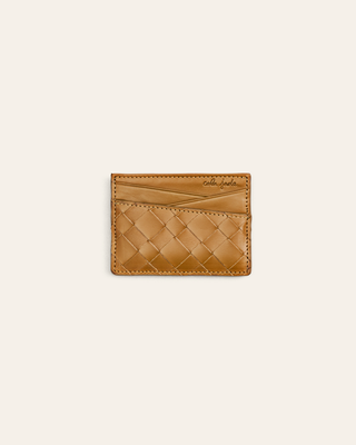 woven sepia brown leather cardholder on a beige background