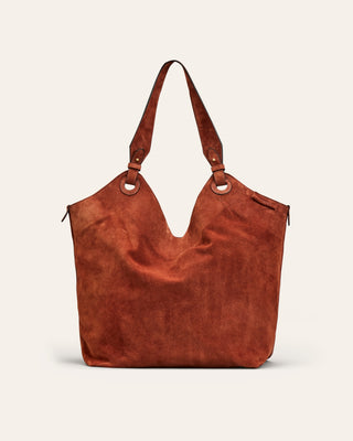 Cala Jade red suede suede handbag on a beige background