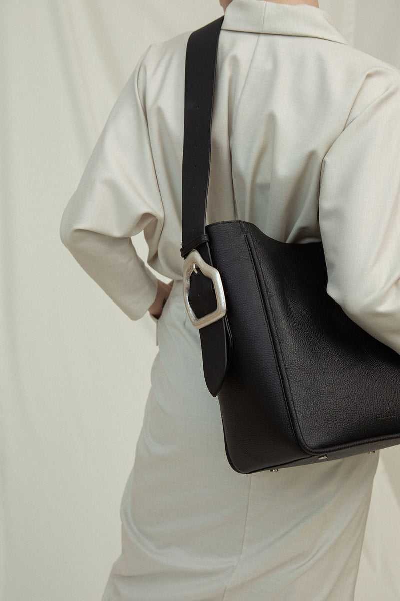 Cala Jade Masago black leather tote bag on model 1