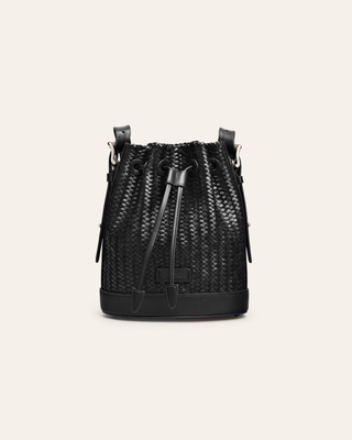 Cala Jade Gaya mini black woven leather bucket bag on abeige backgroundf
