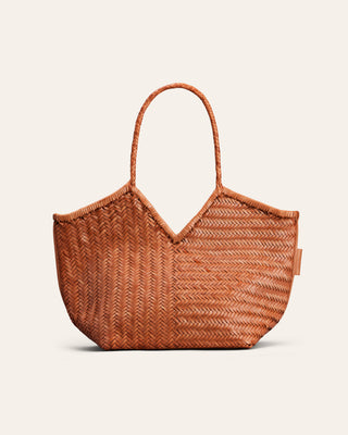 A light brown woven shoulder bag in leather used for product image on a beige background