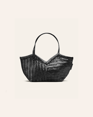 Cala Jade small woven black leather handbag on a beige background 