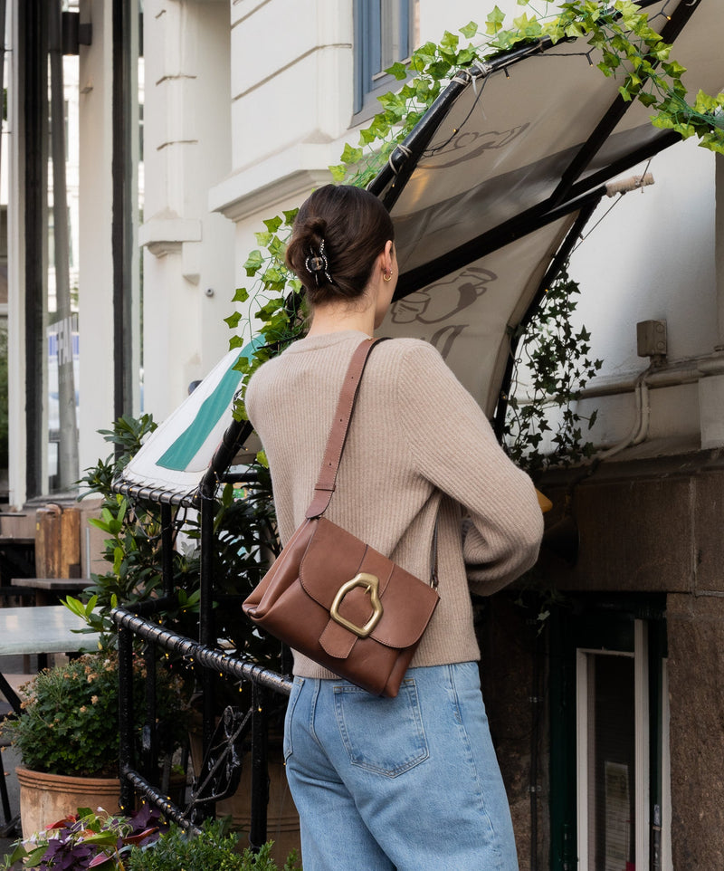 Nami Brown leather bag on a model