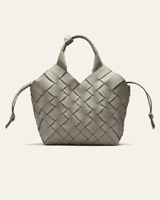 A grey woven leather handbag on a white background