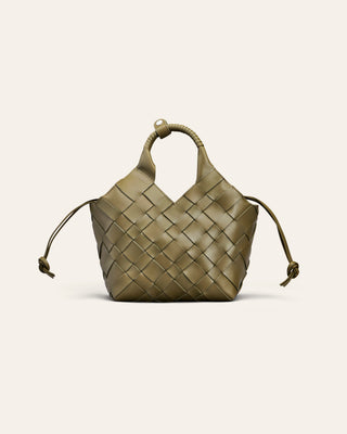 An olive green leather shoulder bag in a woven shape on a beige background