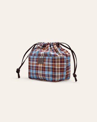 Plaid drawstring bag on a light gray background