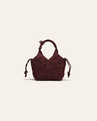 Brown woven handbag on a light beige background