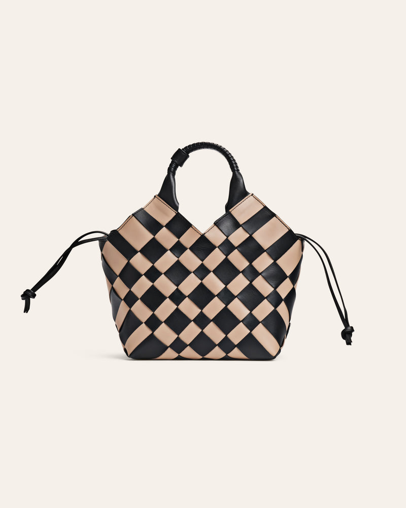 Checkered handbag with black and beige pattern on a light beige background