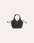 Dark green suede woven handbag on a beige background