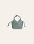 Light blue woven handbag on a light gray background