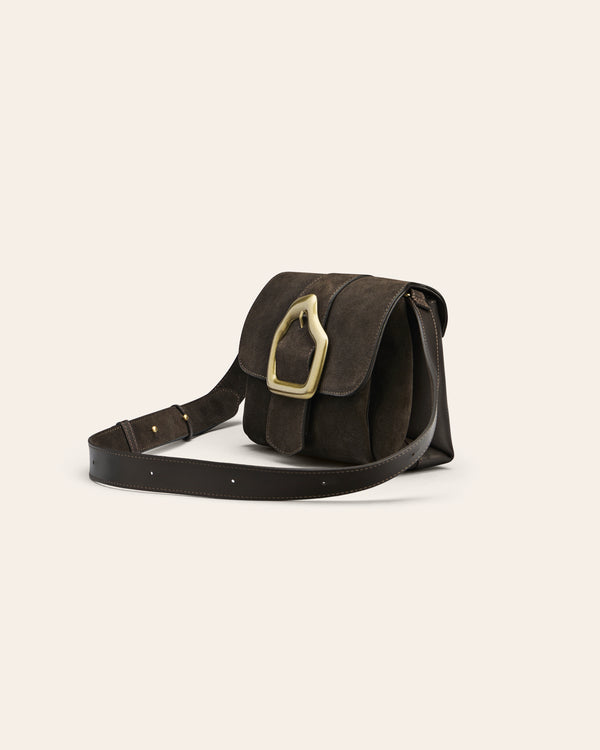 Brown suede shoulder bag with gold buckle on beige background