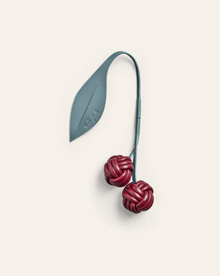 Leather bag charm shaped as a cherry in blue and burgundy