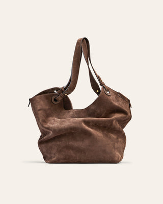 Cala Jade Brown suede handbag on a beige background