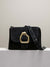 Cala Jade black suede shoulder bag with gold buckle