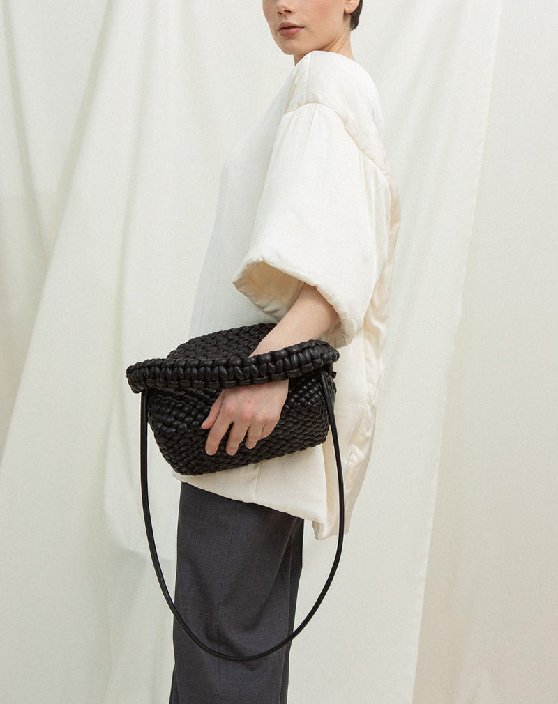 Cala Jade hana leather clutch on model