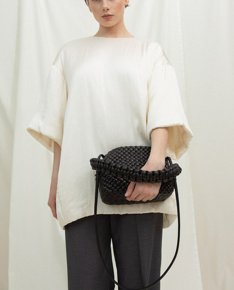 Cala Jade hana leather clutch on model